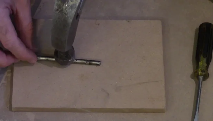 Bend the pin: Gently bend the pin slightly using a hard surface to create more friction against the hinge.