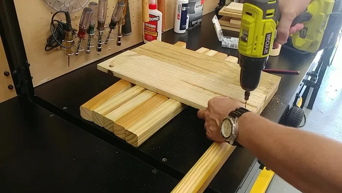 Build the ends: Stack two of the 17 3/4-inch boards on top of a half-baluster and attach them securely with screws. Repeat for the other end, ensuring they are mirror images.