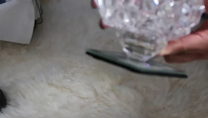 Add height to a crystal bowl using a glued-on tea light candle for a unique decorative element.