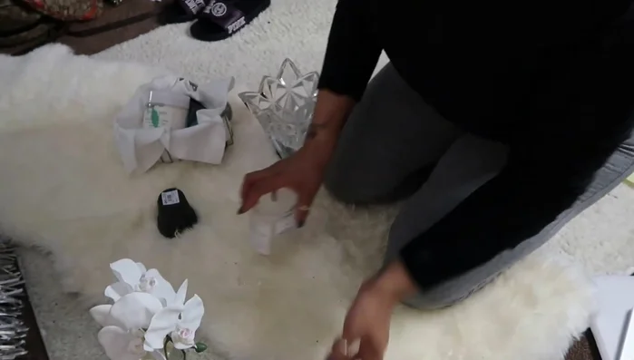 Add a multi-tiered tray on top of a piece of glass to create a wider base for displaying items.