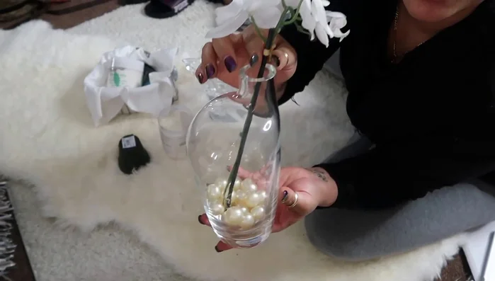 Add a multi-tiered tray on top of a piece of glass to create a wider base for displaying items.