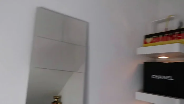 Design and create a unique mirror arrangement using multiple small mirrors on a board.