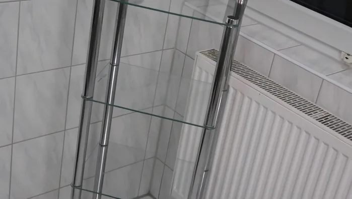 Add a multi-tiered tray on top of a piece of glass to create a wider base for displaying items.