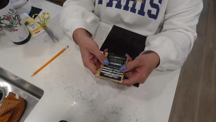 Measure and cut your photos to fit inside the frames. If needed, trim slightly to avoid showing beneath the frame's lip.