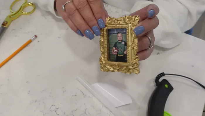 Attach the magnetic frames to your refrigerator.