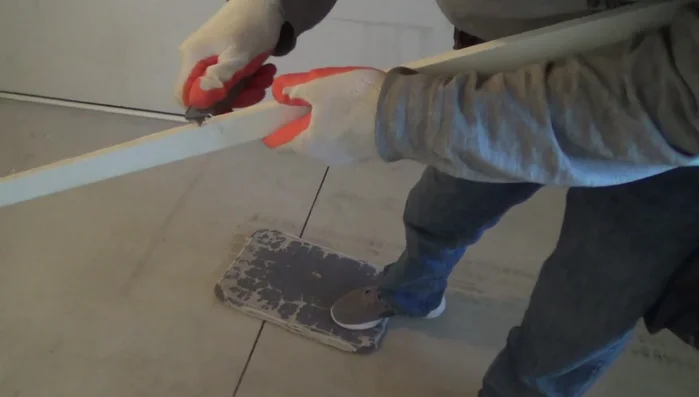 If necessary, adjust the strike plate by moving it slightly and re-installing it to further refine the door alignment. 