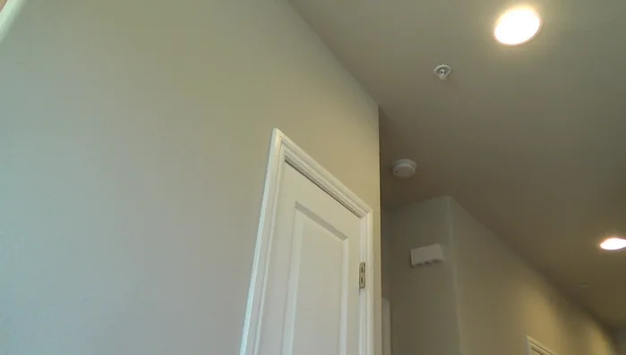 Clean old caulking and excess wood from the door stop area.