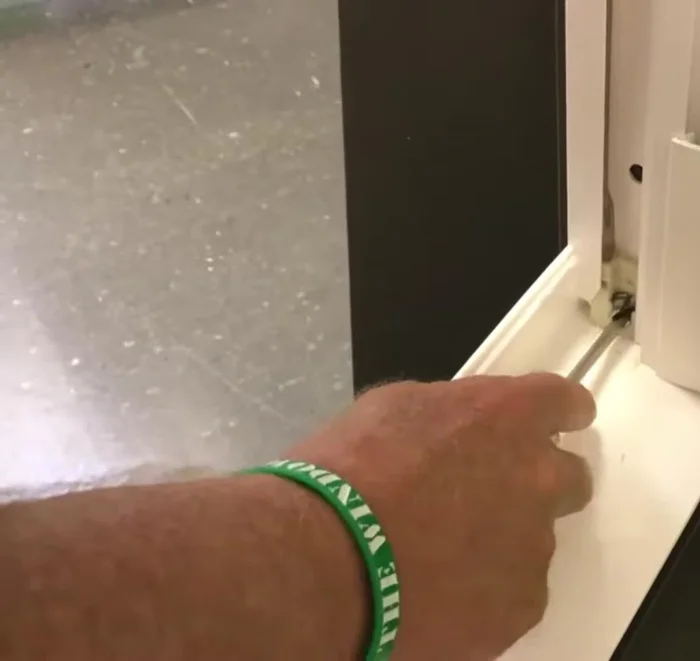 Use a flathead screwdriver to gently lift the window sash, releasing the tension.