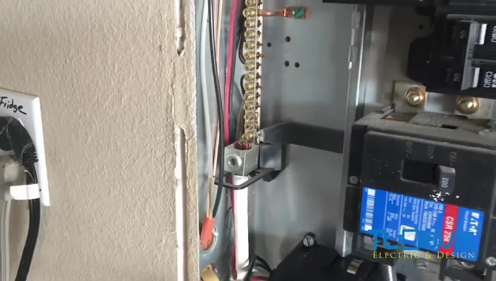 Reconnect the wires to the relocated breaker. Ensure the wires are fully inserted before tightening the screws.