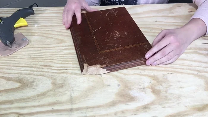 Create a mold of an undamaged corner using hot glue. Apply Vaseline to the undamaged corner first to prevent the hot glue from sticking.