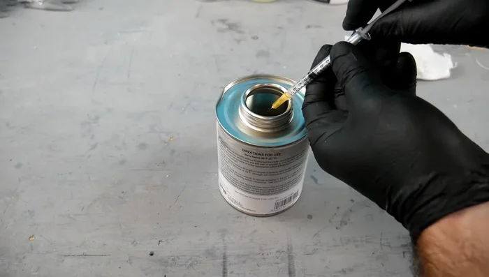 Apply solvents: Using syringes and needles, apply a thin layer of each solvent to one surface of each pair of acrylic sheets.