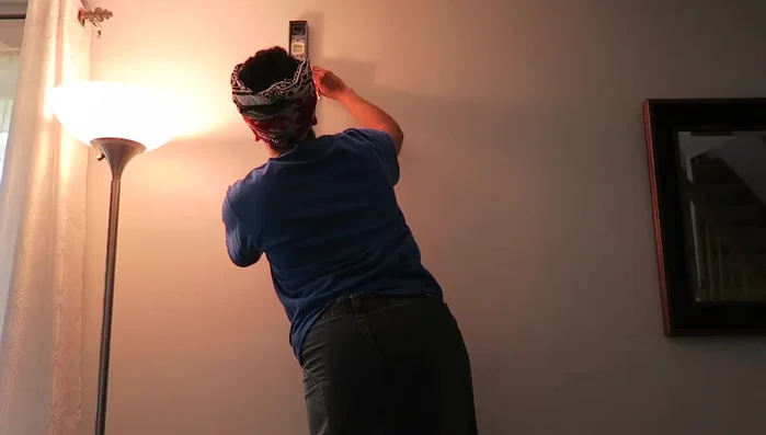 Attach ropes to boards: Securely tie the prepared rope loops to the holes in the boards. Use a level to ensure even hanging.