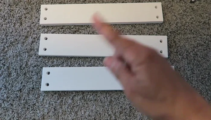 Attach ropes to boards: Securely tie the prepared rope loops to the holes in the boards. Use a level to ensure even hanging.