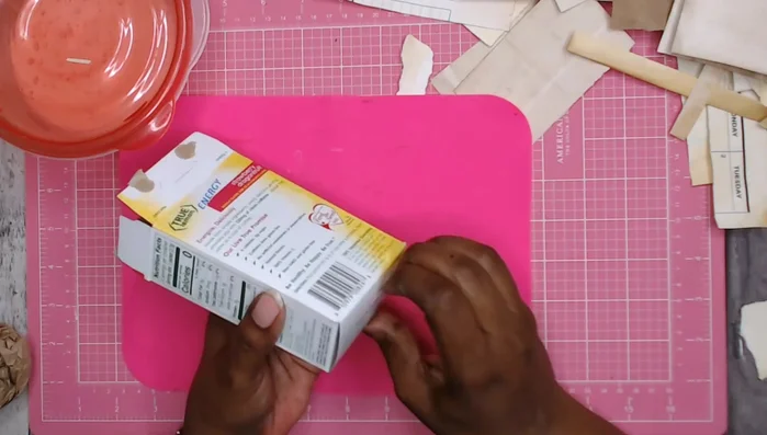 Cover the chipboard base (optional): Wrap the chipboard base with packing paper using DIY Mod Podge or similar adhesive.