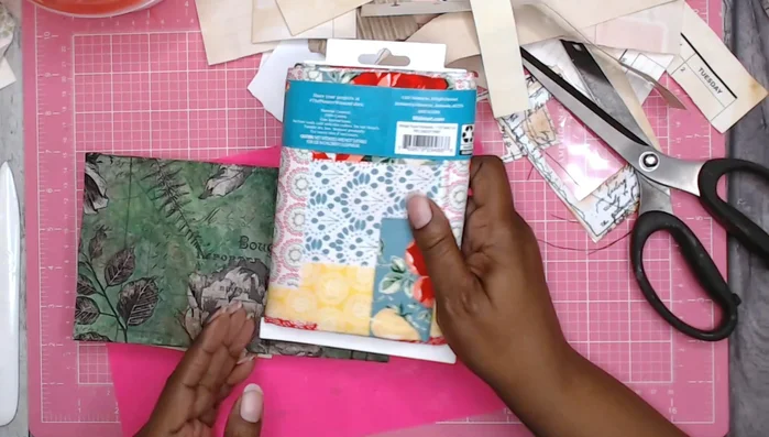 Prepare the spine: Cut a piece of fabric slightly wider than the spine area. Attach a piece from the original box, slightly smaller than the fabric, to the back of the fabric.