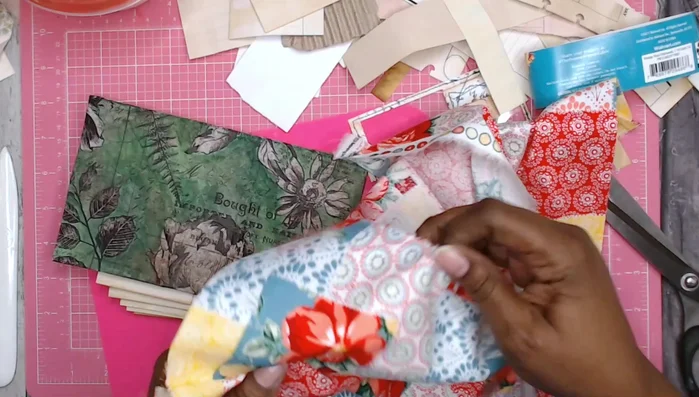 Sew the signatures: Stitch the signatures to the fabric spine.