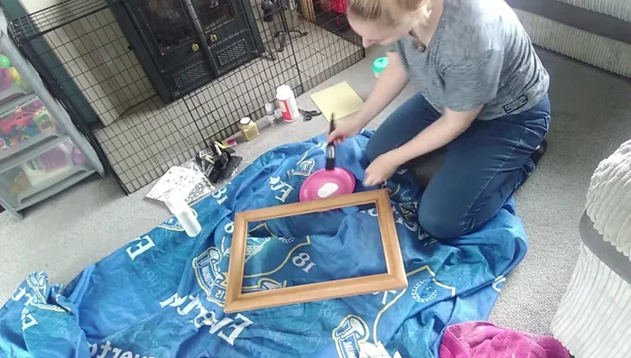 Paint the frame with a base coat of acrylic paint. Don't aim for perfection; brushstrokes will add to the shabby chic look.