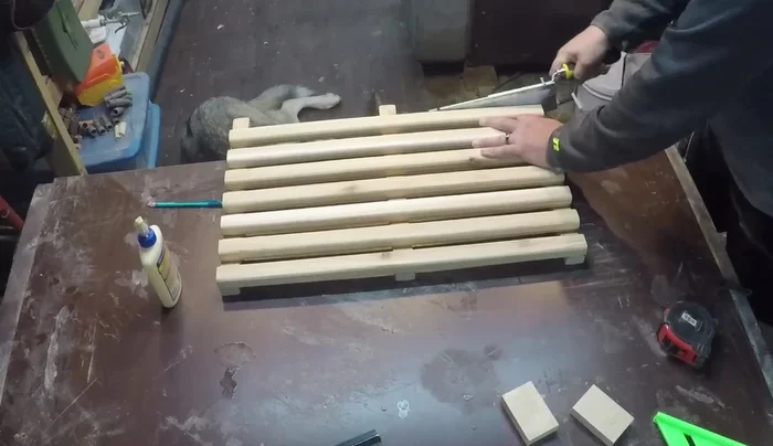 Trim the excess length from the bottom supports using a flush-cut saw for a clean finish.