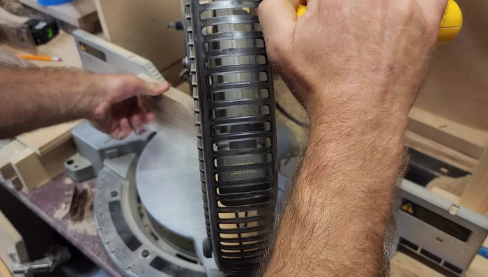 Address the cracked knot by super gluing it back in place and carefully routing around it. (Note: This step is presented as a possible solution and not always guaranteed to work.)