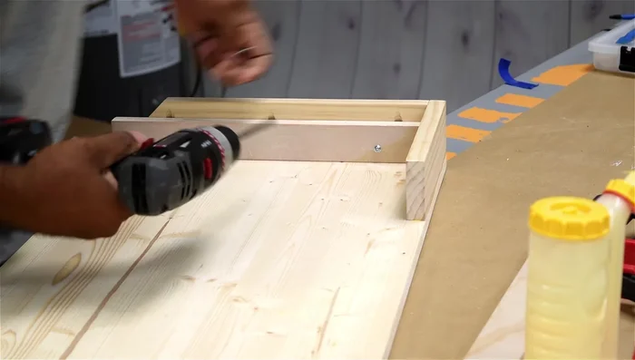 Install the lower panel and bottom using pocket holes and glue.