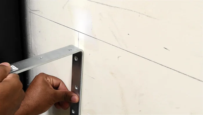 Mark and install wall brackets, ensuring level alignment.