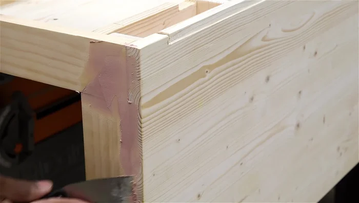 Paint the desk and stain the drawer (optional).