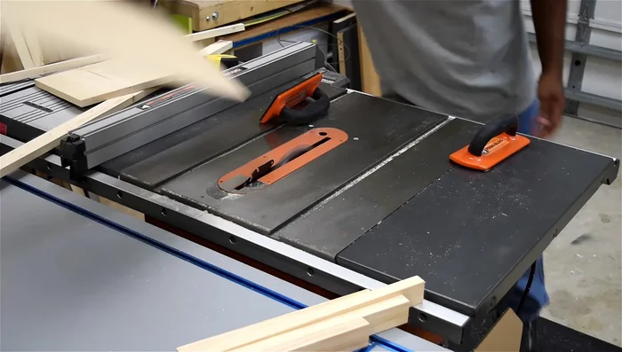 Create drawer slide tracks using a router and making sure there's a little play for smooth operation.