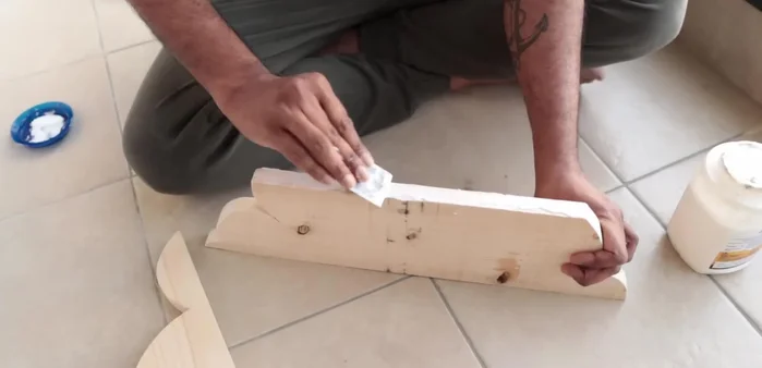 Fill imperfections (bumps, dents, holes) with wood filler.