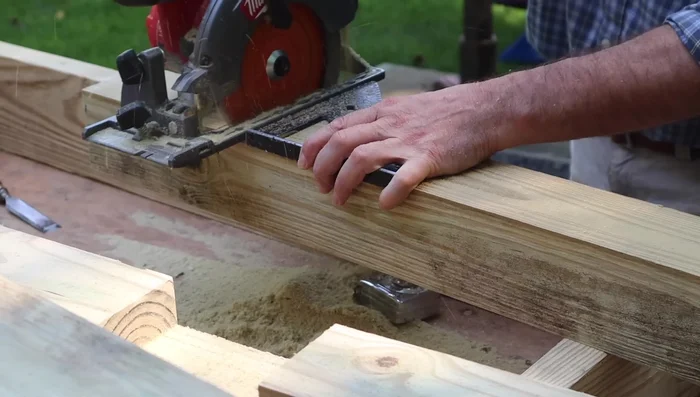 Cut decorative angles on posts: Cut a 45-degree angle at the top of each post.