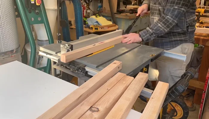 Add cedar pickets and weed block to the bottom shelf. This will allow drainage while preventing soil from escaping.