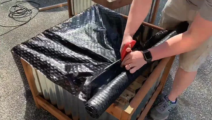 Add cedar pickets and weed block to the bottom shelf. This will allow drainage while preventing soil from escaping.