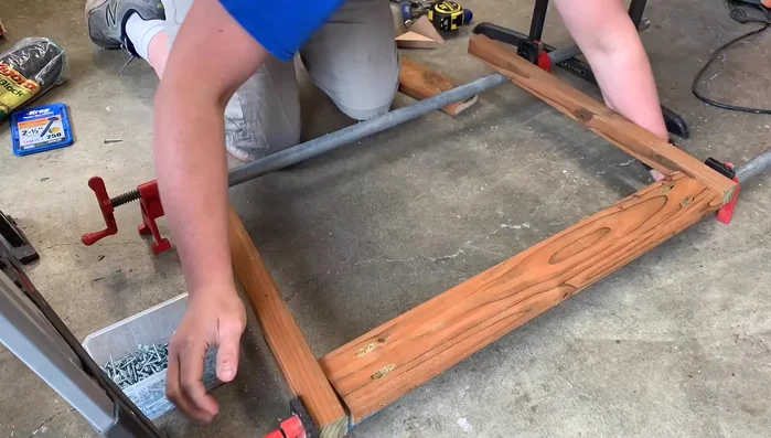 Drill pocket holes using a Kreg jig and assemble the frame using exterior screws and clamps for a tight hold.