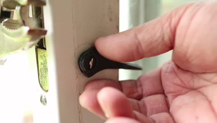 Remove the old latch from the door frame.