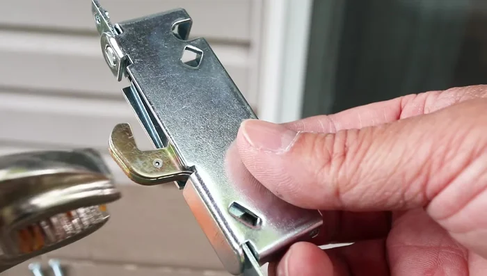 Attach vice grips to the hook of the new latch (clamp onto the flat part for a secure hold).