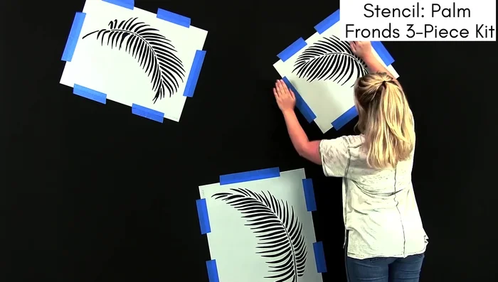 Place stencils on the wall.