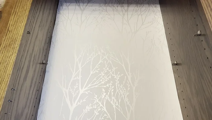 Add 3D butterfly stickers in a rainbow pattern to the wall.