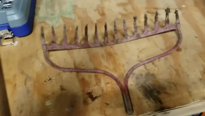 Sand the repaired handle, starting with 80-grit sandpaper and finishing with 150-grit for a smooth surface.