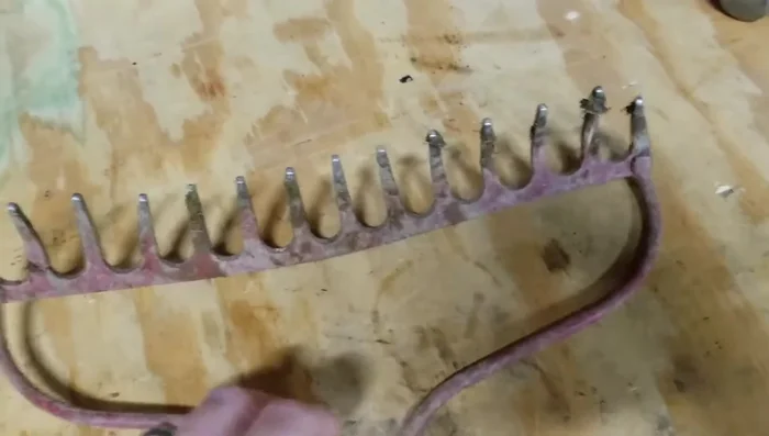 Straighten bent tines using a hammer and a hard surface (concrete or bench vise).