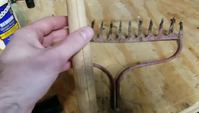 Sand the repaired handle, starting with 80-grit sandpaper and finishing with 150-grit for a smooth surface.