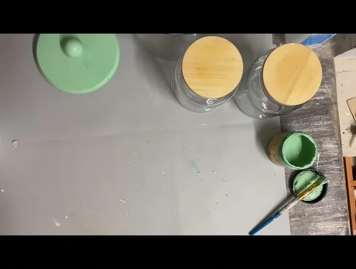 Create a riser: Cut and sand a 1x6 wood piece to desired length. Attach drawer pulls as feet using Tight Bond and hot glue for a secure hold.