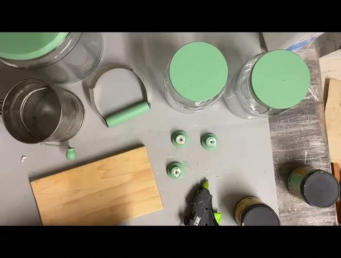 Apply brown glaze: Once the riser is dry, apply brown glaze (Van Dyke brown) to the wood and drawer pulls for a vintage look.