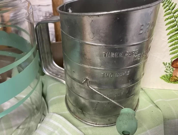 Finalize and display: Paint additional small kitchen tools and incorporate the upcycled jars, riser, and shelf sitter into your kitchen vignette.