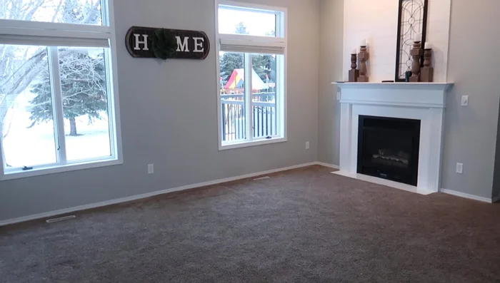 Carpet Installation: Remove old carpet and install new light gray carpet with beige and gray flecks.