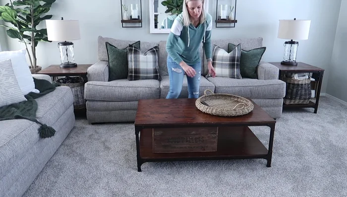 Decorating the Mantle: Add wall art, an arch-shaped decor piece, candlesticks, and a vase with greenery to the mantle.