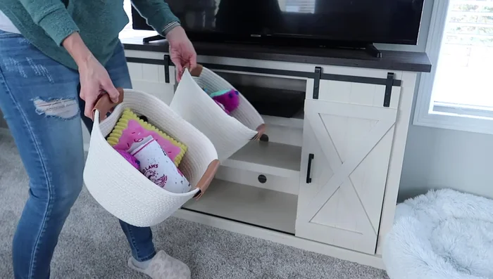 Decorating the Mantle: Add wall art, an arch-shaped decor piece, candlesticks, and a vase with greenery to the mantle.