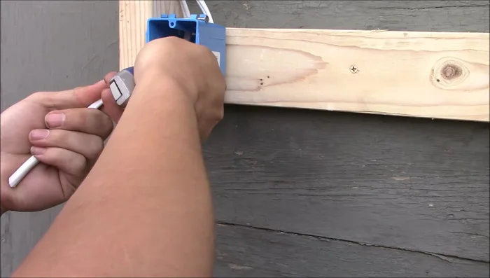 Strip insulation from wires. Identify 14-3 and 14-2 cables.