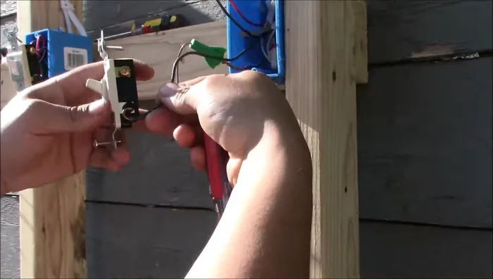 Connect the traveler wires to the bronze terminals of the three-way switch.