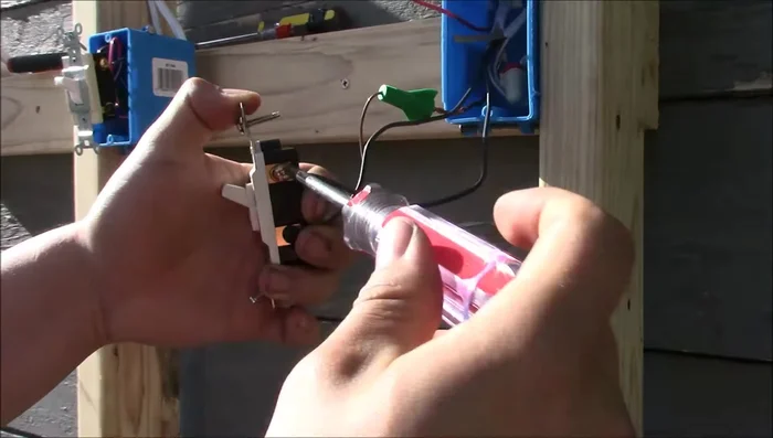 Connect the traveler wires to the bronze terminals of the three-way switch.