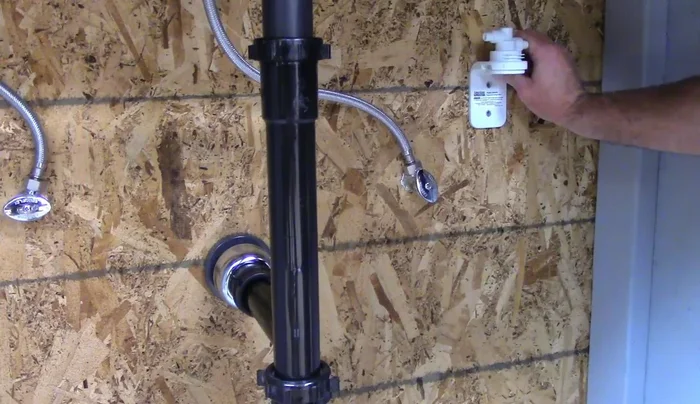 Mount the bracket using screws, tightening them fully after both are in place.