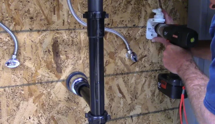 Mount the bracket using screws, tightening them fully after both are in place.